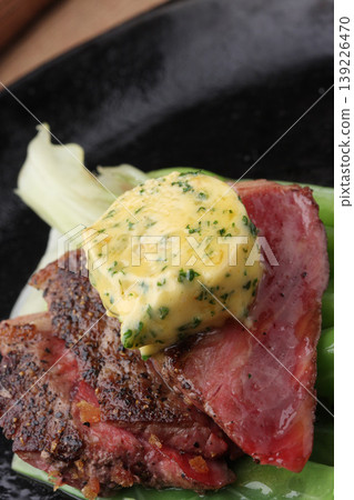 Meat dishes topped with herb butter Meat dishes topped with herb butter 139226470