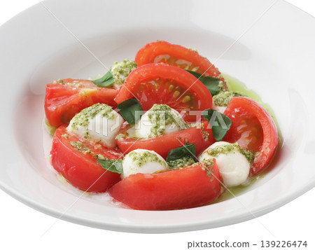 Caprese is a salad made with tomatoes, basil, and mozzarella cheese. 139226474