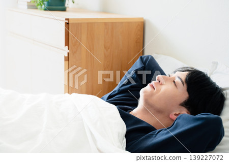 A young man oversleeps 139227072