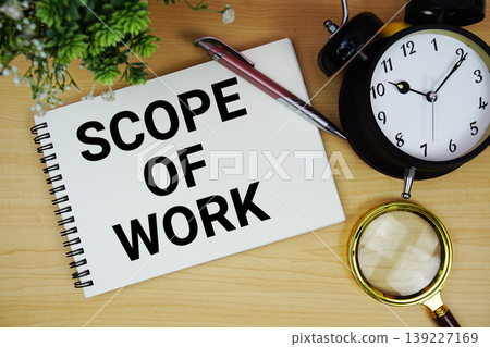 Scope Of Work text written on notepad with alarm clock and magnifying glass flat lay on wooden background Scope Of Work text written on notepad with alarm clock and magnifying glass flat lay on wooden background 139227169