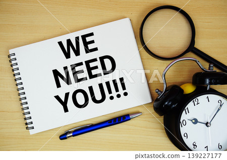 We Need You text written on notepad with alarm clock and magnifying glass flat lay on wooden background We Need You text written on notepad with alarm clock and magnifying glass flat lay on wooden background 139227177