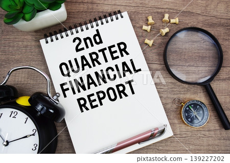 2nd Quarter Financial Report text written on notepad with alarm clock, compass and magnifying glass flat lay on wooden background 2nd Quarter Financial Report text written on notepad with alarm clock, compass and magnifying glass flat lay on wooden background 139227202