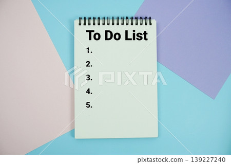 To Do List text written on notepad flat lay on multicolor pastel background To Do List text written on notepad flat lay on multicolor pastel background 139227240