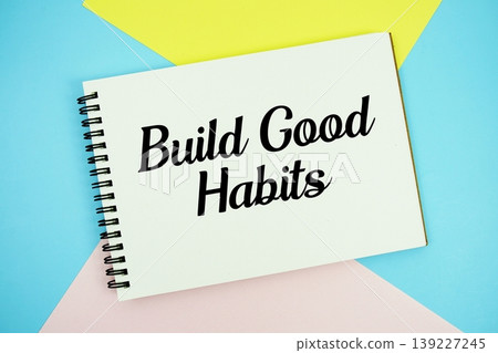 Build Good Habits text written on notepad flat lay on multicolor pastel background Build Good Habits text written on notepad flat lay on multicolor pastel background 139227245