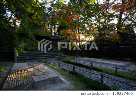 A scene from the grounds of Honen-in Temple at dusk in autumn. A scene from the grounds of Honen-in Temple at dusk in autumn. 139227400