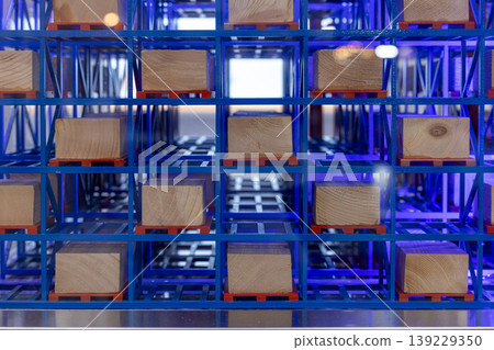 Automated warehouse racking system with wooden pallets, Modern smart storage system, Smart warehouse technology and inventory management, Geometric blue industrial shelving for logistic. Automated warehouse racking system with wooden pallets, Modern smart storage system, Smart warehouse technology and inventory management, Geometric blue industrial shelving for logistic. 139229350