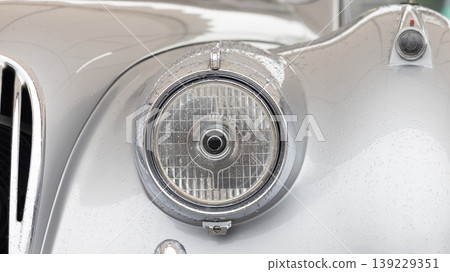 Headlights on classic car, Vintage car headlight, Classic retro car with close-up on headlight. 139229351