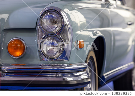 Headlights on classic car, Vintage car headlight, Classic retro car with close-up on headlight. Headlights on classic car, Vintage car headlight, Classic retro car with close-up on headlight. 139229355