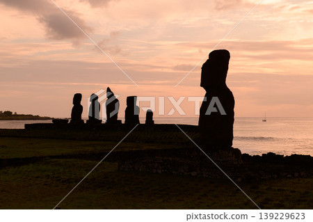 Mysterious easter island silhouette of moai statue glowing at peaceful chile sunset 139229623