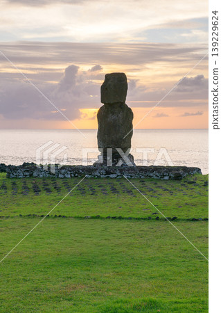 Solemn ancient moai statue stands on easter island chile during peaceful sunset 139229624