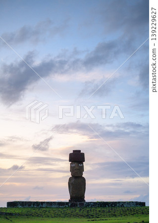 Calm and serene stone moai statue under dusk sky on easter island chile Calm and serene stone moai statue under dusk sky on easter island chile 139229627