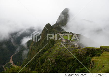 Majestic machu picchu mountain ruin emerges from mysterious thick fog Majestic machu picchu mountain ruin emerges from mysterious thick fog 139229716