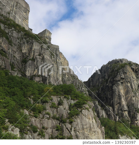 Famous Pulpit Rock Preikestolen and travel destination, seen from below, Norway. Famous Pulpit Rock Preikestolen and travel destination, seen from below, Norway. 139230397