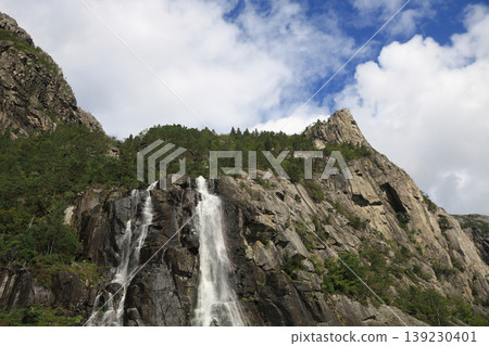 Hengjanefossen, popular waterfall in the Lysefjord, Norway. Hengjanefossen, popular waterfall in the Lysefjord, Norway. 139230401