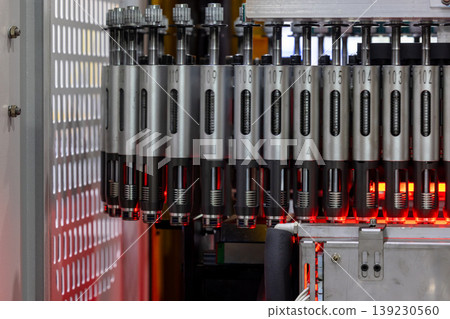 Automatic glass bottle inspection machine, Automation machine in modern factory technology demonstration bottles in the industry, High speed inspection. Automatic glass bottle inspection machine, Automation machine in modern factory technology demonstration bottles in the industry, High speed inspection. 139230560