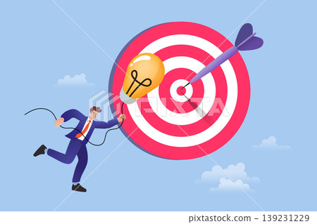 Man holding glowing lightbulb running towards a big target with dart representing innovative strategy successful marketing reaching objective and creative solution in business 139231229