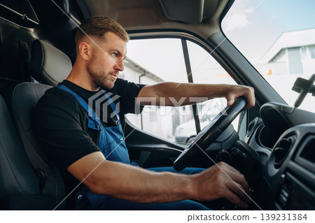 Inside of the bus with delivery service man in uniform Inside of the bus with delivery service man in uniform 139231384