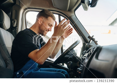 Inside of the bus with delivery service man in uniform Inside of the bus with delivery service man in uniform 139231390