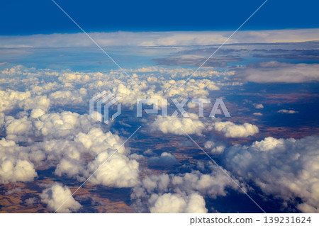 Aerial view of clouds and blue sky while flying Aerial view of clouds and blue sky while flying 139231624