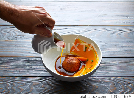 Dumpling of old cowtail with creamy carrot Dumpling of old cowtail with creamy carrot 139231659