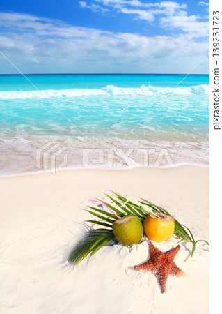 coconut cocktails juice and starfish in tropical beach coconut cocktails juice and starfish in tropical beach 139231723