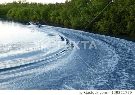 Boat ship wake prop wash sunset lake river Boat ship wake prop wash sunset lake river 139231759