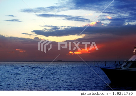 Caribbean sea sunset in Mexico Isla Mujeres boat Caribbean sea sunset in Mexico Isla Mujeres boat 139231780