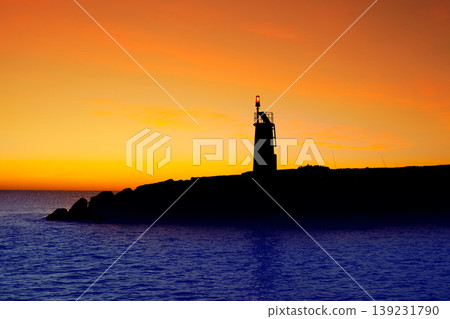 Golden sunrise sunset in sea red beacon lighthouse Golden sunrise sunset in sea red beacon lighthouse 139231790