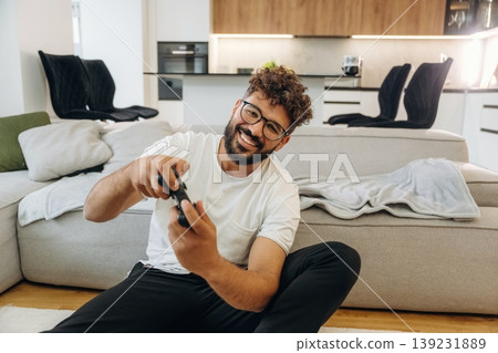 Man is in the modern domestic room at home Man is in the modern domestic room at home 139231889