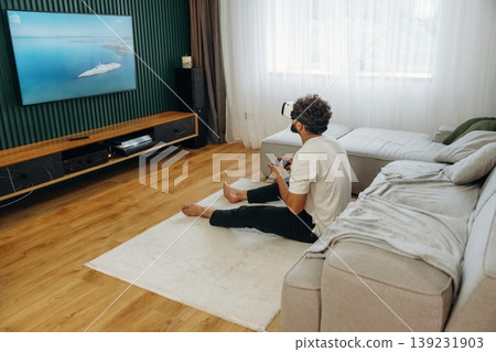 Man is in the modern domestic room at home Man is in the modern domestic room at home 139231903