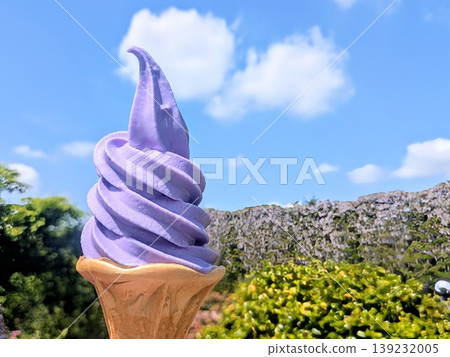 A purple soft-serve ice cream enjoyed under a blue sky – a perfect summer dessert image. A purple soft-serve ice cream enjoyed under a blue sky – a perfect summer dessert image. 139232005