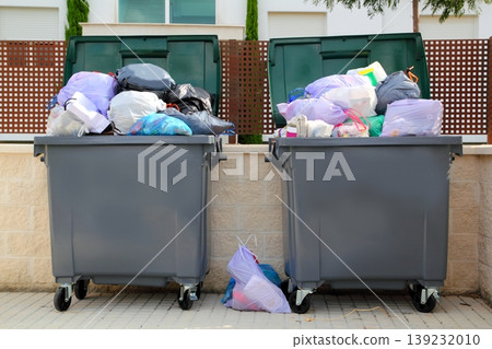 Trash garbage full container in street Trash garbage full container in street 139232010