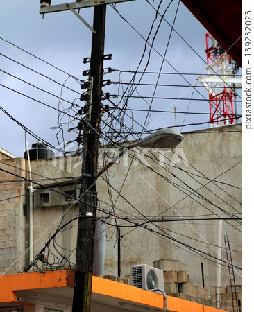 messy electric cables wooden pole busy skyscape messy electric cables wooden pole busy skyscape 139232023