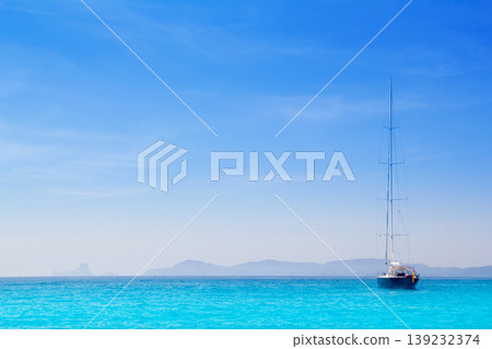 Ibiza mountains with sailboat from Formentera Ibiza mountains with sailboat from Formentera 139232374