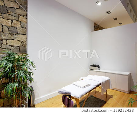 Massage room with massage table Massage room with massage table 139232428