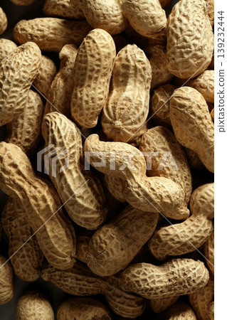 Peanuts macro over wood background Peanuts macro over wood background 139232444