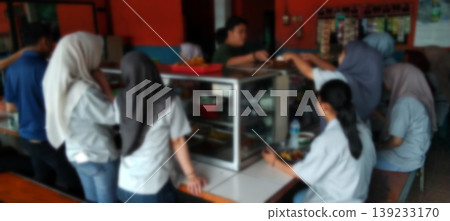 The atmosphere of the school canteen with students queuing to buy food. The atmosphere of the school canteen with students queuing to buy food. 139233170