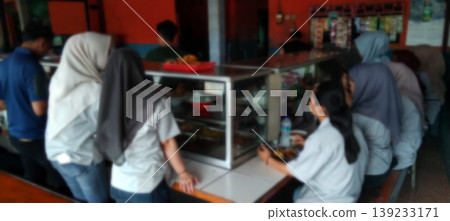 The atmosphere of the school canteen with students queuing to buy food. The atmosphere of the school canteen with students queuing to buy food. 139233171
