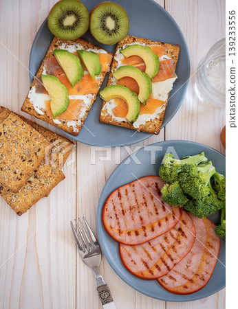 sandwiches with salmon and avocado, kiwi, jamon york sandwiches with salmon and avocado, kiwi, jamon york 139233556