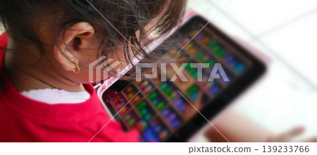 Children Play with Tablets with Focus on Digital Screens Children Play with Tablets with Focus on Digital Screens 139233766