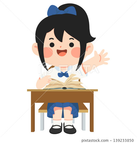 Girl Raising Hand At Desk With Book In Classroom 139233850