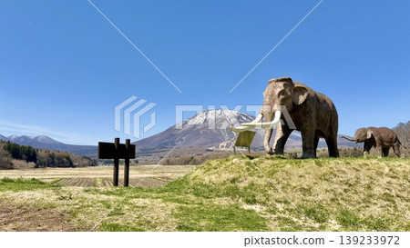 The statue of the mother and child Naumann's elephant at Lake Nojiri and the remaining snow on Mt. Kurohime from National Route 18 The statue of the mother and child Naumann's elephant at Lake Nojiri and the remaining snow on Mt. Kurohime from National Route 18 139233972