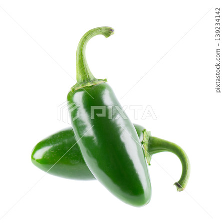 Fresh jalapeno pepper isolated on white background. Slices of green hot serrano pepper. Clipping path. Fresh jalapeno pepper isolated on white background. Slices of green hot serrano pepper. Clipping path. 139234142