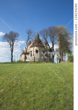 Ruins of Mary Magdalene Roman Catholic Church in Vovkiv village standing on a green hill Ruins of Mary Magdalene Roman Catholic Church in Vovkiv village standing on a green hill 139234260