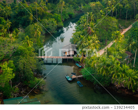 Aerial view of a local fishing house on a tropical river. Aerial view of a local fishing house on a tropical river. 139234405