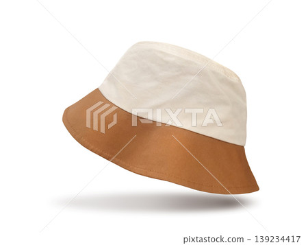 A white and brown bucket hat floats stylishly against a white background. A white and brown bucket hat floats stylishly against a white background. 139234417