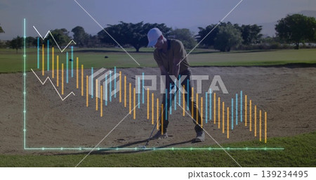 Aligning golfer in olive polo swinging club in sand bunker on golf course, with candlestick overlay 139234495