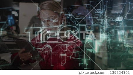 Blond professional in red blouse reviewing tablet in modern tech office, with holographic circuits Blond professional in red blouse reviewing tablet in modern tech office, with holographic circuits 139234501