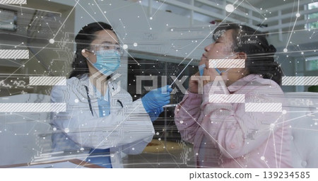Taking nasal swab stick doctor wearing coat mask gloves testing patient in clinic, with desk Taking nasal swab stick doctor wearing coat mask gloves testing patient in clinic, with desk 139234585