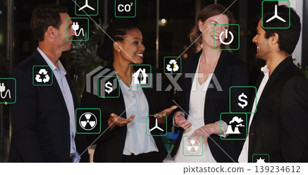 Discussing business professionals exploring energy saving in office lounge, with energy icons 139234612